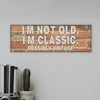 “Funny sarcastic plaque reading ‘I’m Not Old, I’m Classic Possibly Vintage’ printed on MDF retro-style wall sign”