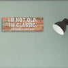 “Funny sarcastic plaque reading ‘I’m Not Old, I’m Classic Possibly Vintage’ printed on MDF retro-style wall sign”