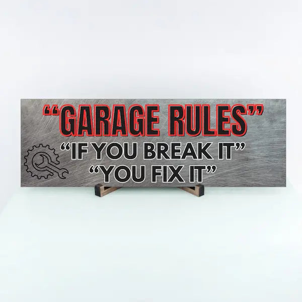 Garage Rules MDF plaque with bold text: “If You Break It, You Fix It,” styled in industrial, humorous typography.