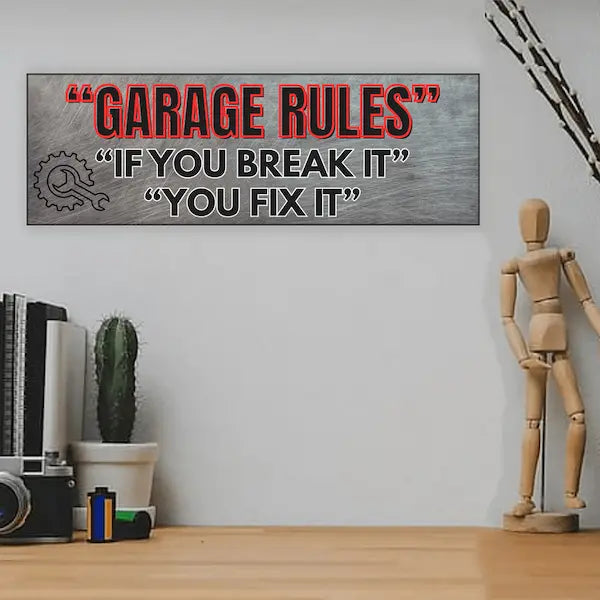 Garage Rules MDF plaque with bold text: “If You Break It, You Fix It,” styled in industrial, humorous typography.