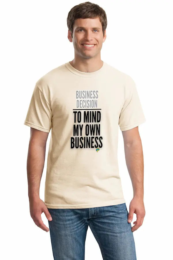 Natural unisex t-shirt with bold text reading “Business Decision To Mind My Own Business” displayed flat on a neutral background.