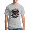 Cotton T-shirt with bold “American Pride – Forged by Work” text, modeled on a rugged workspace background.