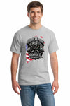 Cotton T-shirt with bold “American Pride – Forged by Work” text, modeled on a rugged workspace background.