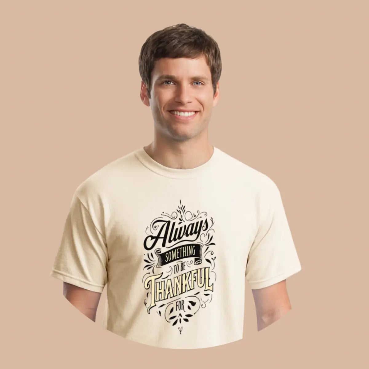 Person wearing the Gratitude T-Shirt, bold text reading “Always Something Thankful For,” casual urban background.